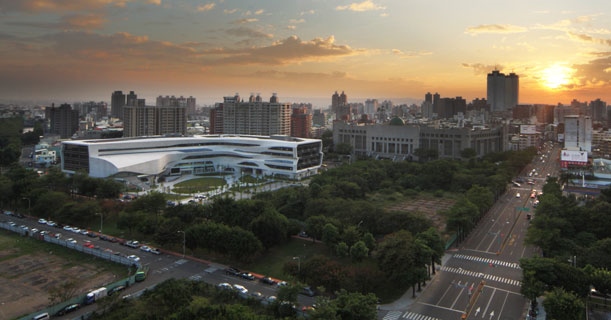 The L-shaped library surrounded by vegetation