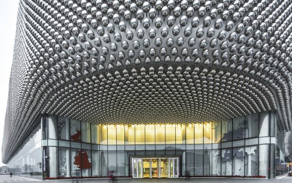 The architectural design of the façade incorporates stainless steel spheres