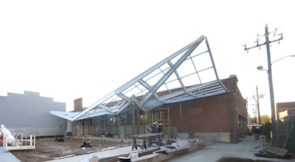 The porch steel structure supports a polycarbonate cover  