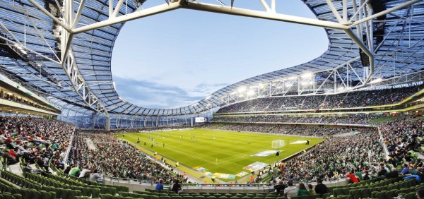 The spectacular stadium roof seems to be suspended over the spectators