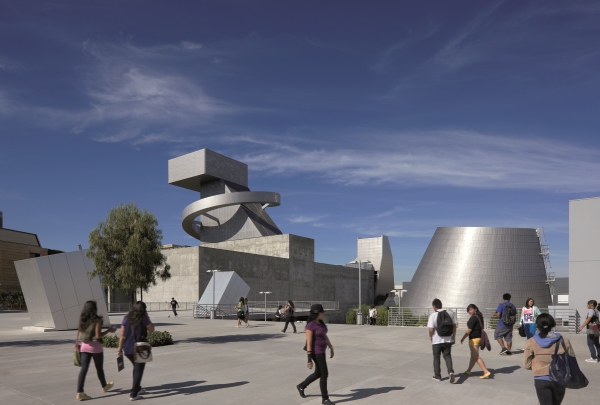 The buildings surrounding the square are covered with brushed stainless steel 